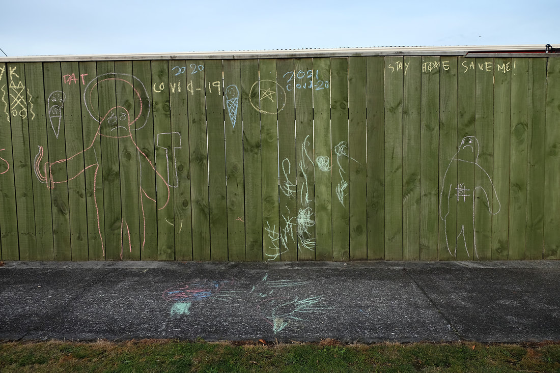 Dan Anbury - Untitled (Fence, Levin), April 2020, Photospace Gallery online exhibition A Month of Sundays - Responses to the Covid-19 lockdown, photographic artists respond to the lockdown in New Zealand, Contemporary New Zealand Photography gallery in Courtenay Place Wellington, children's chalk graffiti writing on fence in Levin Horowhenua during Covid-19 lockdown in New Zealand 2020