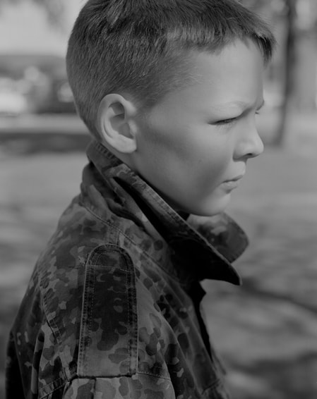 Untitled (boy in camo), photograph by Samuel Scully from 'Going West', Photospace Gallery contemporary New Zealand photography