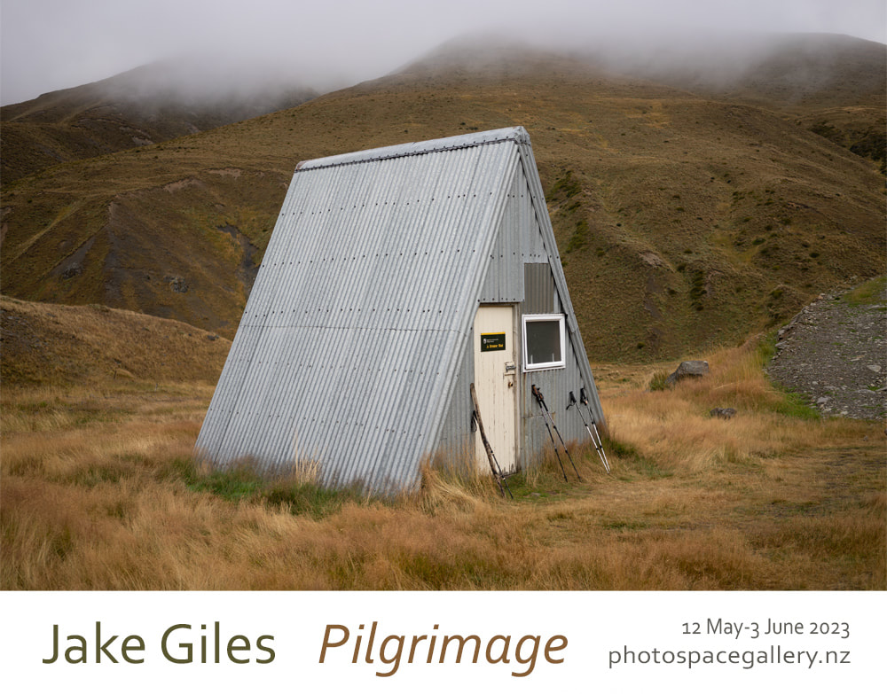 Jake Giles 'Pilgrimage' exhibition poster, Photospace Gallery 12 May-3 June 2023, Wellington NZ , photo of A-frame trampers hut South Island Aotearoa New Zealand, walking and cycling journey around Aotearoa New Zealand, New Zealand South Island photographs during tramping, New Zealand contemporary fine art photography