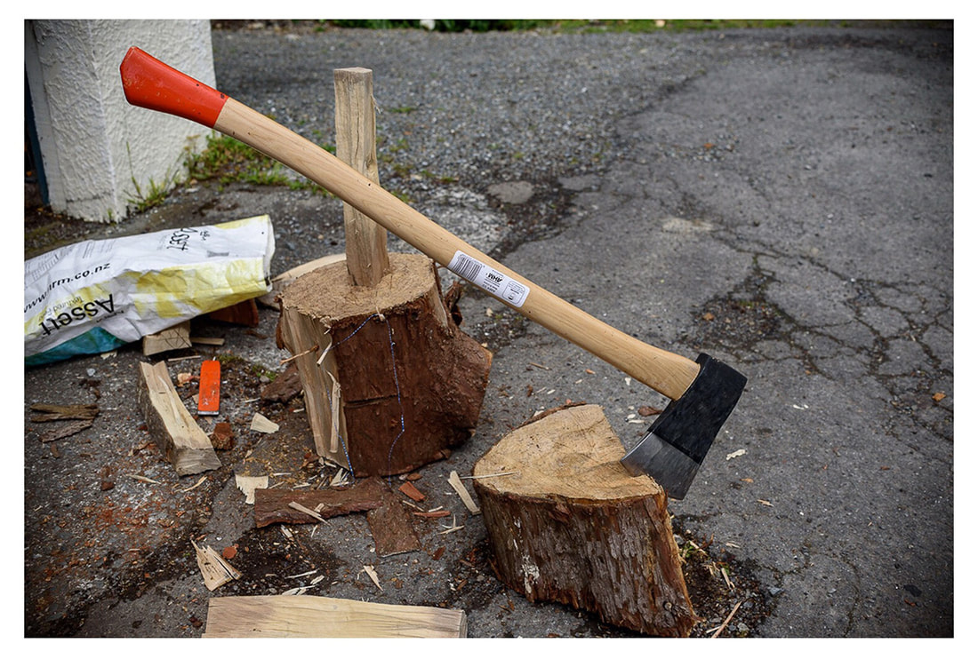 Peter Black - untitled 8, April 2020, A Month of Sundays - Responses to the Covid-19 Lockdown' online exhibition at PhotospaceGallery.nz, axe in log firewood cutting, photography during covid-19 lockdown in New Zealand