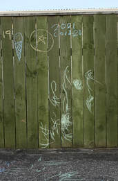 centre detail view of Dan Anbury - Untitled (Fence, Levin), April 2020, Photospace Gallery online exhibition A Month of Sundays - Responses to the Covid-19 lockdown, photographic artists respond to the lockdown in New Zealand, Contemporary New Zealand Photography gallery in Courtenay Place Wellington, children's chalk graffiti writing on fence in Levin Horowhenua during Covid-19 lockdown in New Zealand 2020
